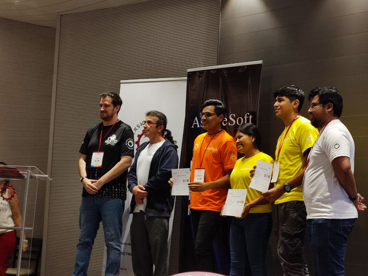 Teams receiving their participation certificates on stage