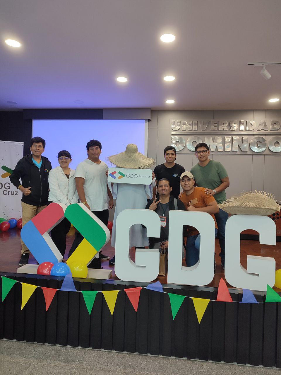 Volunteers and speakers at the DevFest photo stand