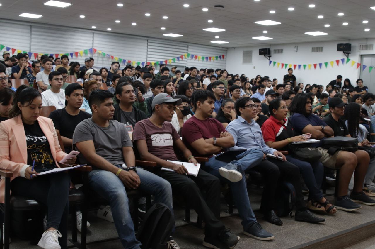 Attendees taking notes during the technical part of the talk